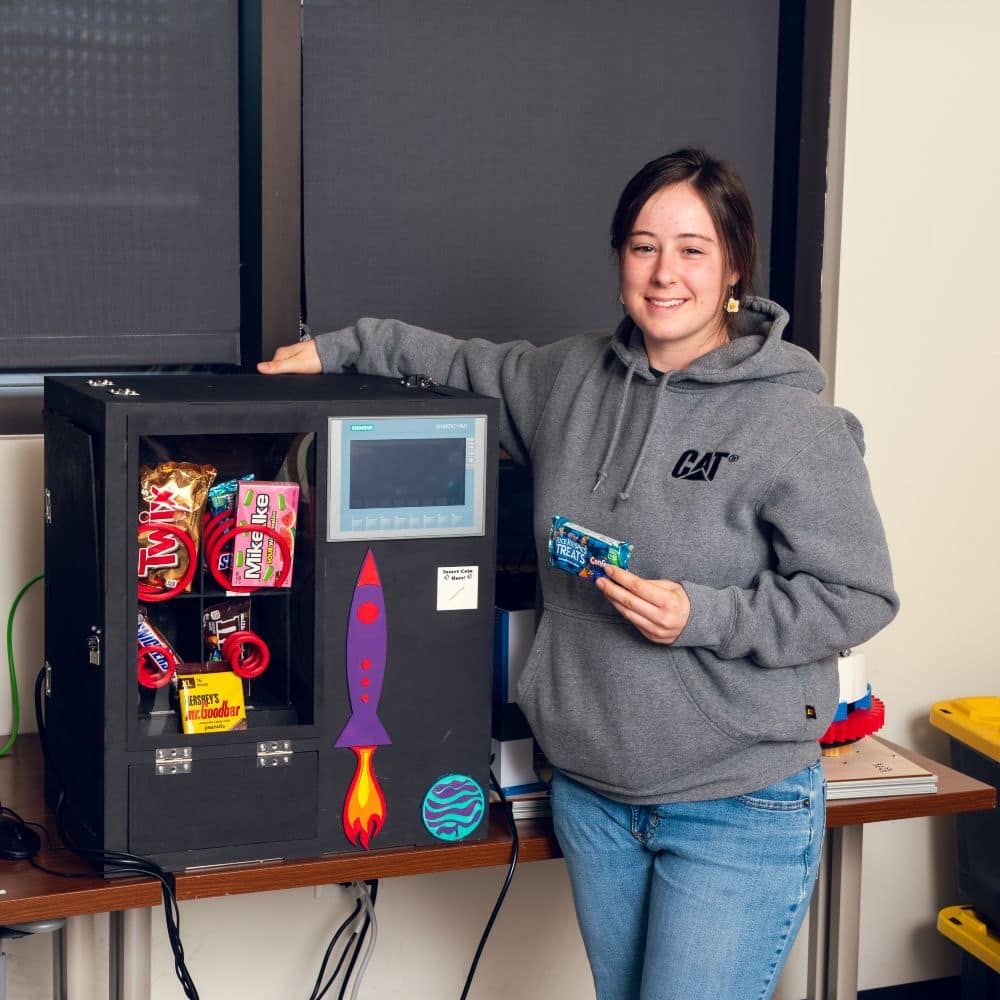 It may look like a model, but Alexis Hall’s vending machine dispenses candy.