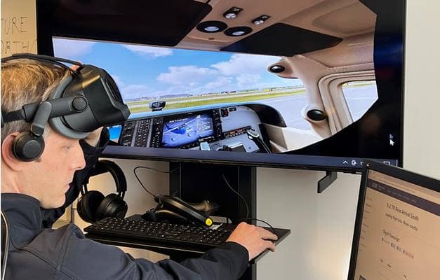 Aviation English Coordinator Andrew Schneider demonstrates use of the virtual Air Traffic Control Lab at Embry-Riddle’s Daytona Beach Campus. 