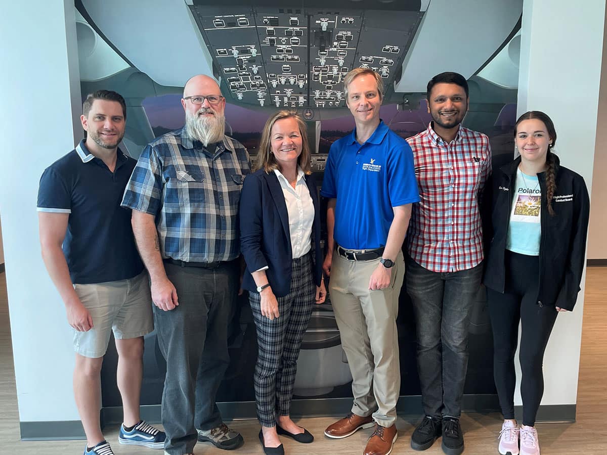 (From left to right) Graduate students Lucas Epperson and Joseph O’Brien; Kristy Kiernan, associate director of the Boeing Center for Aviation and Aerospace Safety; Andrew Schneider, assistant professor in the College of Aviation; Ph.D. student Joel Samu; and undergraduate student Evelyn Itzkowitz