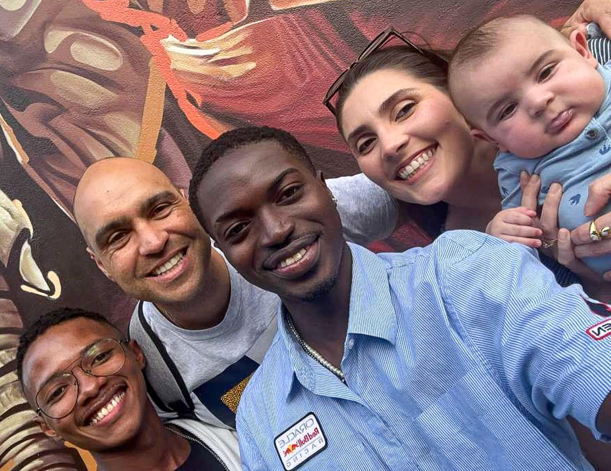 – Embry-Riddle conversation partner Chad Willock takes a photo in São Paulo with Brazilian controllers Neto and Flávia Margiota (right) and their baby Alvaro. Aurélio Melo, another of his students, is also pictured on the far left.
