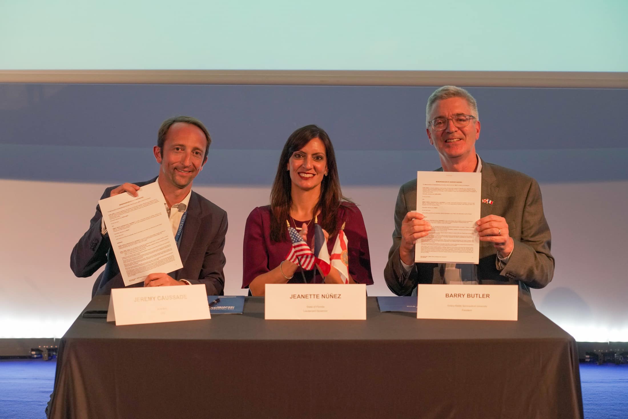 Embry-Riddle President P. Barry Butler, Ph.D. (right), signed a partnership with Aura Aero CEO Jérémy Caussade (left) and Florida Lt. Gov. Jeanette Nuñez (middle), this week at the Paris Air Show. (Photo: TJ Villamil)