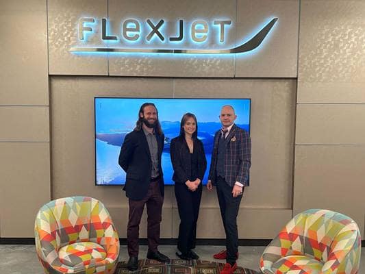 Flexjet’s Innovation and Career Center Manager Michael Campobasso (left) and faculty member Dr. Mihhail Berezovski (right) with Embry-Riddle student Annaelise Swanson (center)