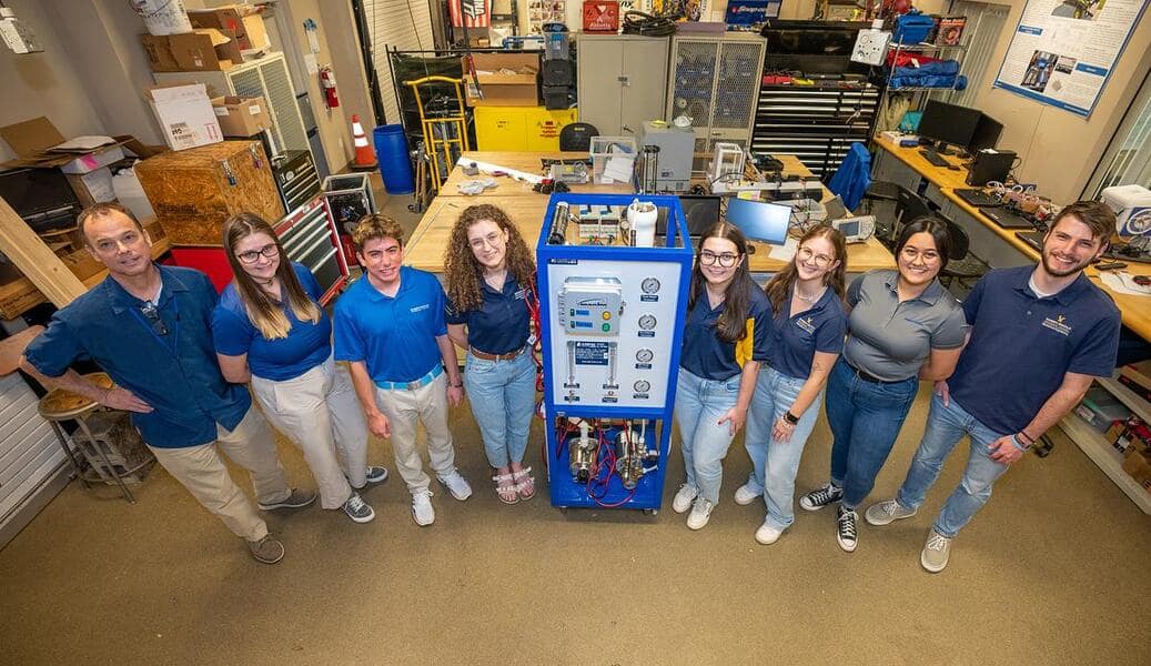 Pure Water Project team members pose in their lab