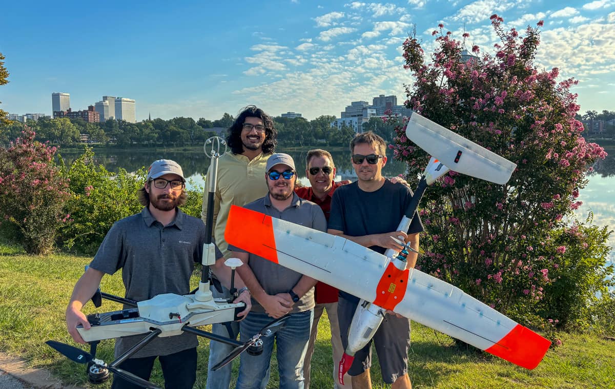 An Embry-Riddle team holds two drones used to take measurements in a campaign around Tulsa, Oklahoma. The team comprised (from left) undergraduate Colin Deputy, Professor Avinash Muthu Krishnan, undergraduate David Zink, Dr. Kevin Adkins and Maciej Stachura, of Black Swift Technologies.