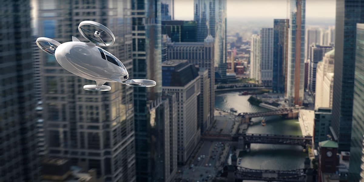 A vertical-takeoff air taxi hovers over a city