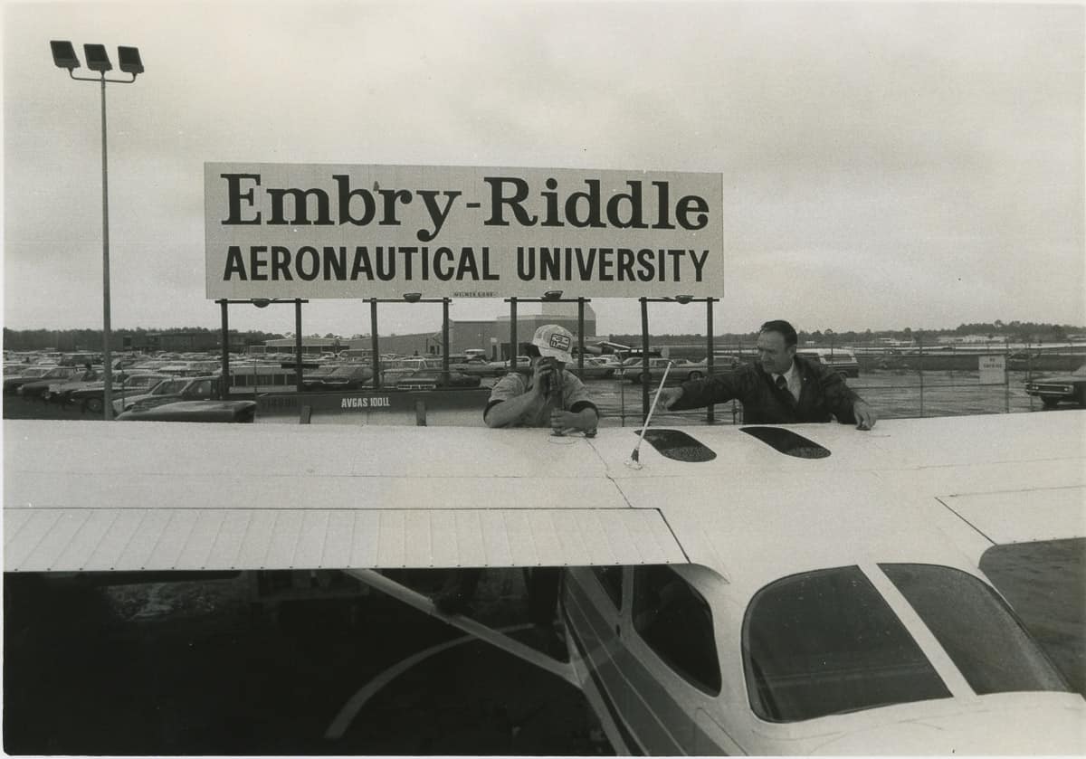 Tail of Cessna 172 in front of Embry-Riddle sign in the 1970s 