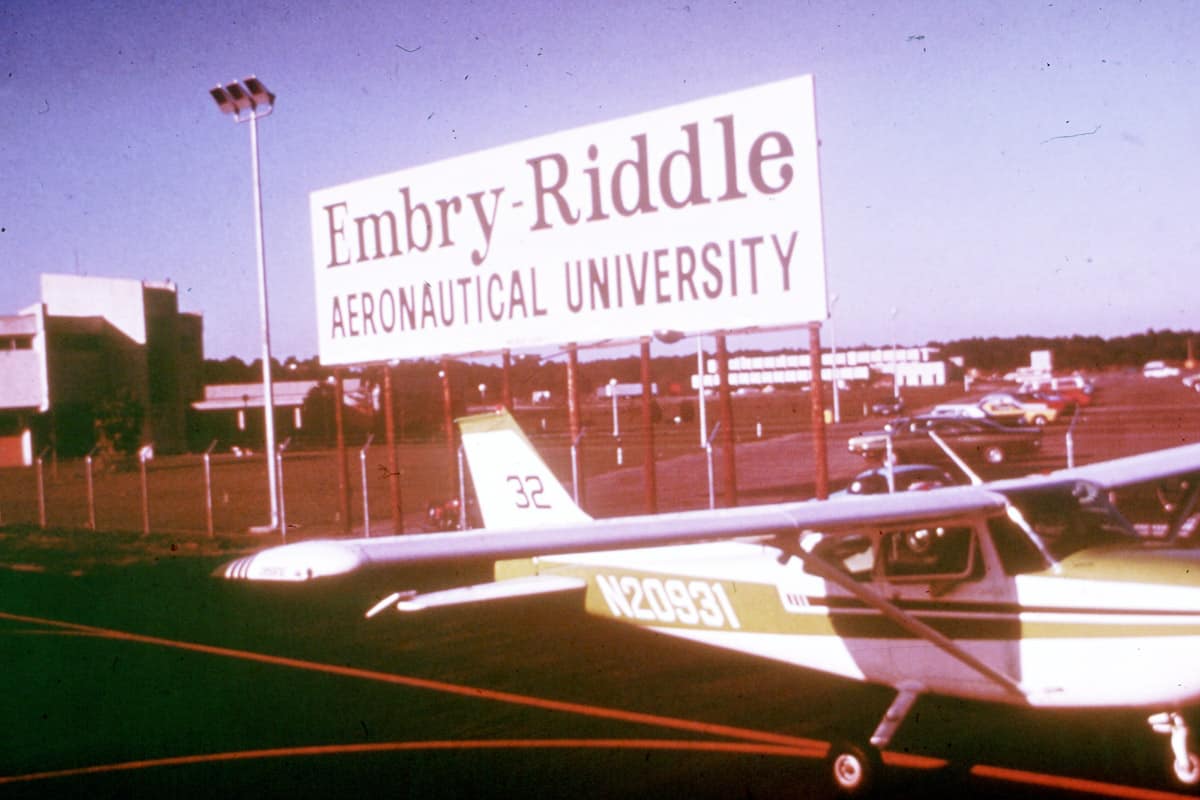 Cessna 172 on flight line in front of Embry-Riddle sign