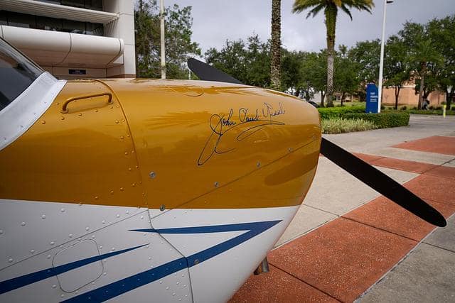 Founder John Paul Riddle’s signature is painted on the nose of the centennial-themed Cessna 172