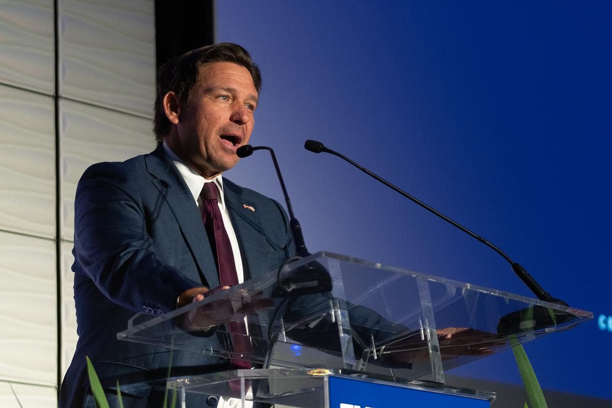 Florida Gov. Ron DeSantis at podium at Embry-Riddle centennial event