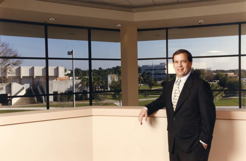 Sliwa stands in Capt. Willie Miller Instructional Center