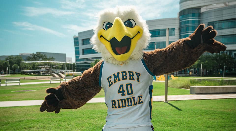 Embry-Riddle mascot Ernie the eagle standing outdoors on a green lawn