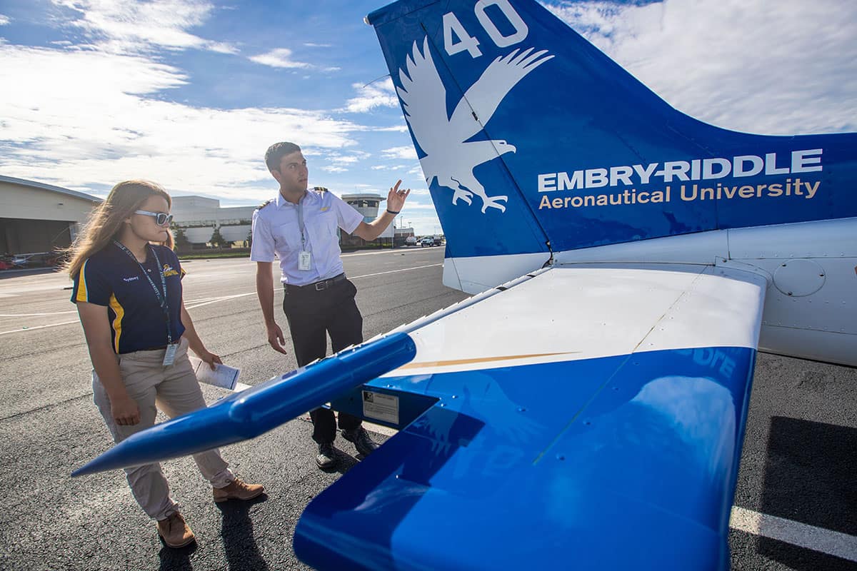 Flight instructor Tyler Rispoli performs a pre-flight check with Sydney Pilling on the Flight Line at Embry-Riddle's Daytona Beach Campus.
