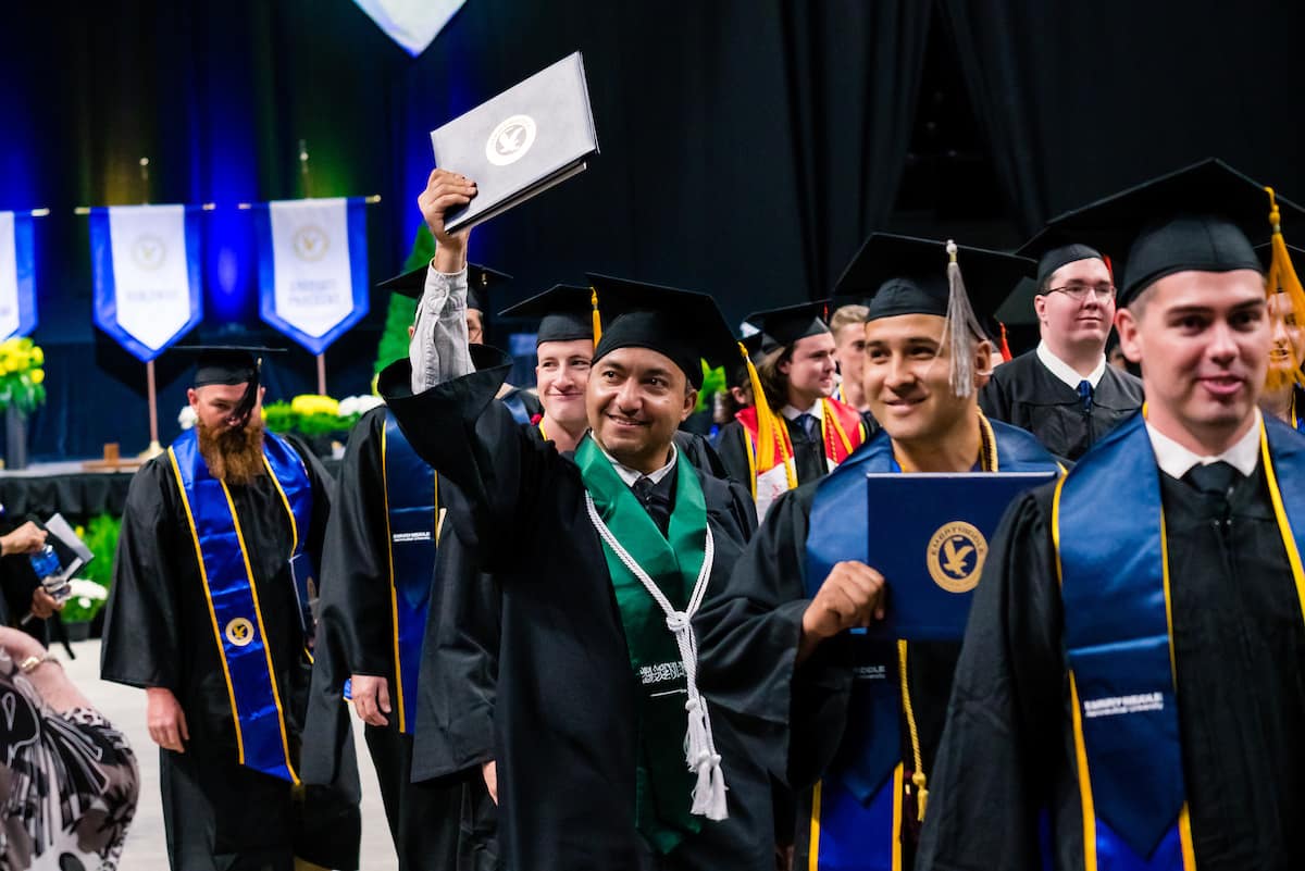 Prescott graduates walk at commencement