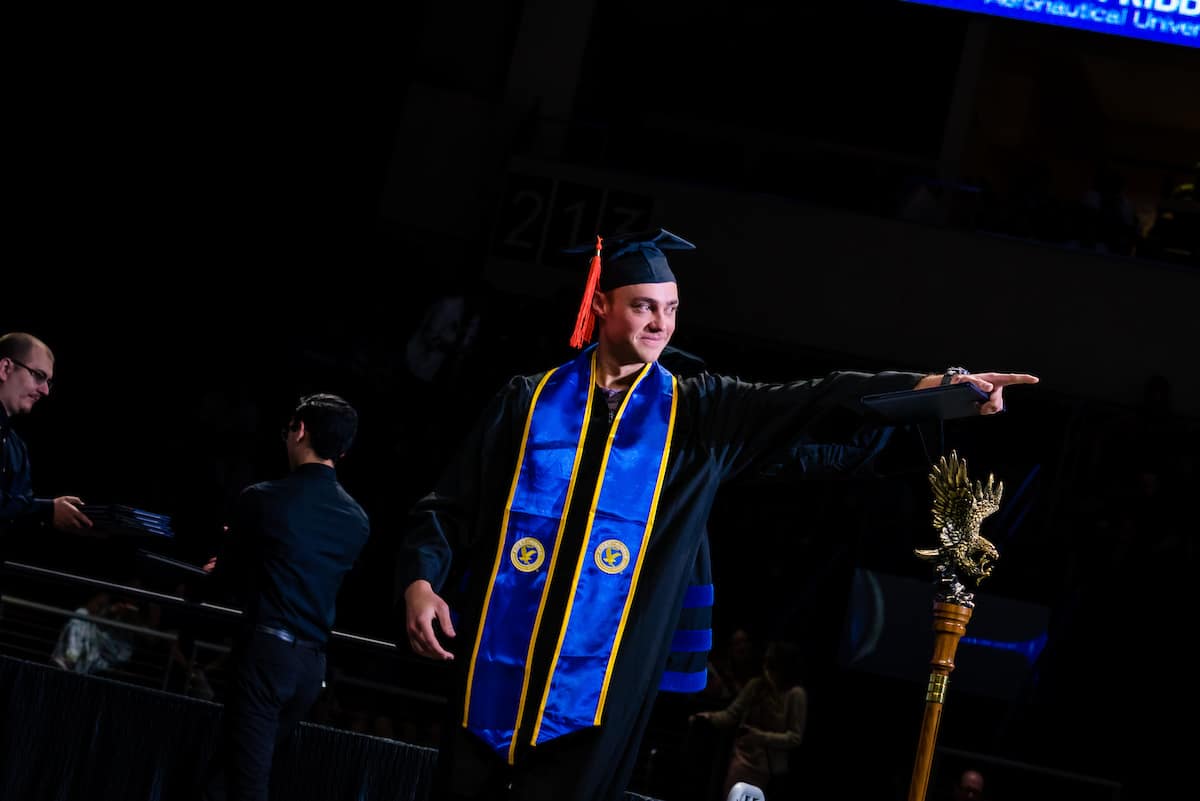 Student walks across the stage