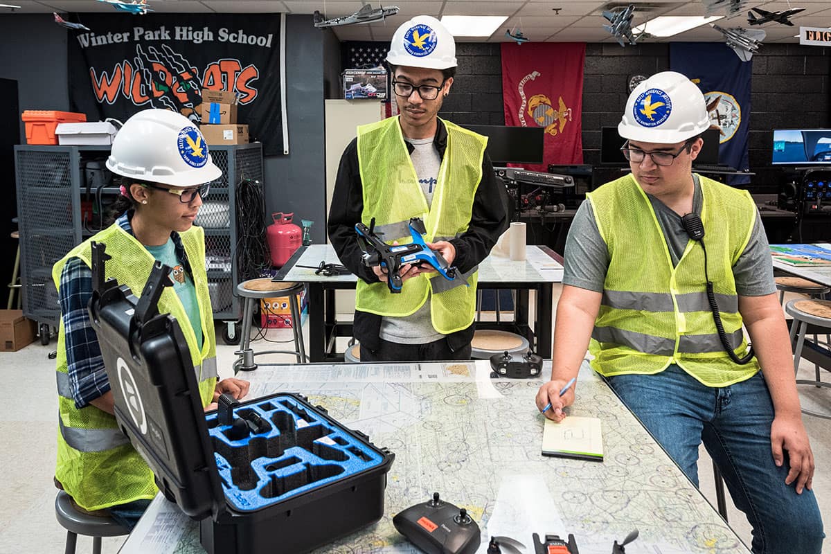 Winter Park High School students Isabella Gutierrez, Aiden Williams and Robert Rosado work on a drone project as part of Embry-Riddle’s Gaetz Aerospace Career Academy