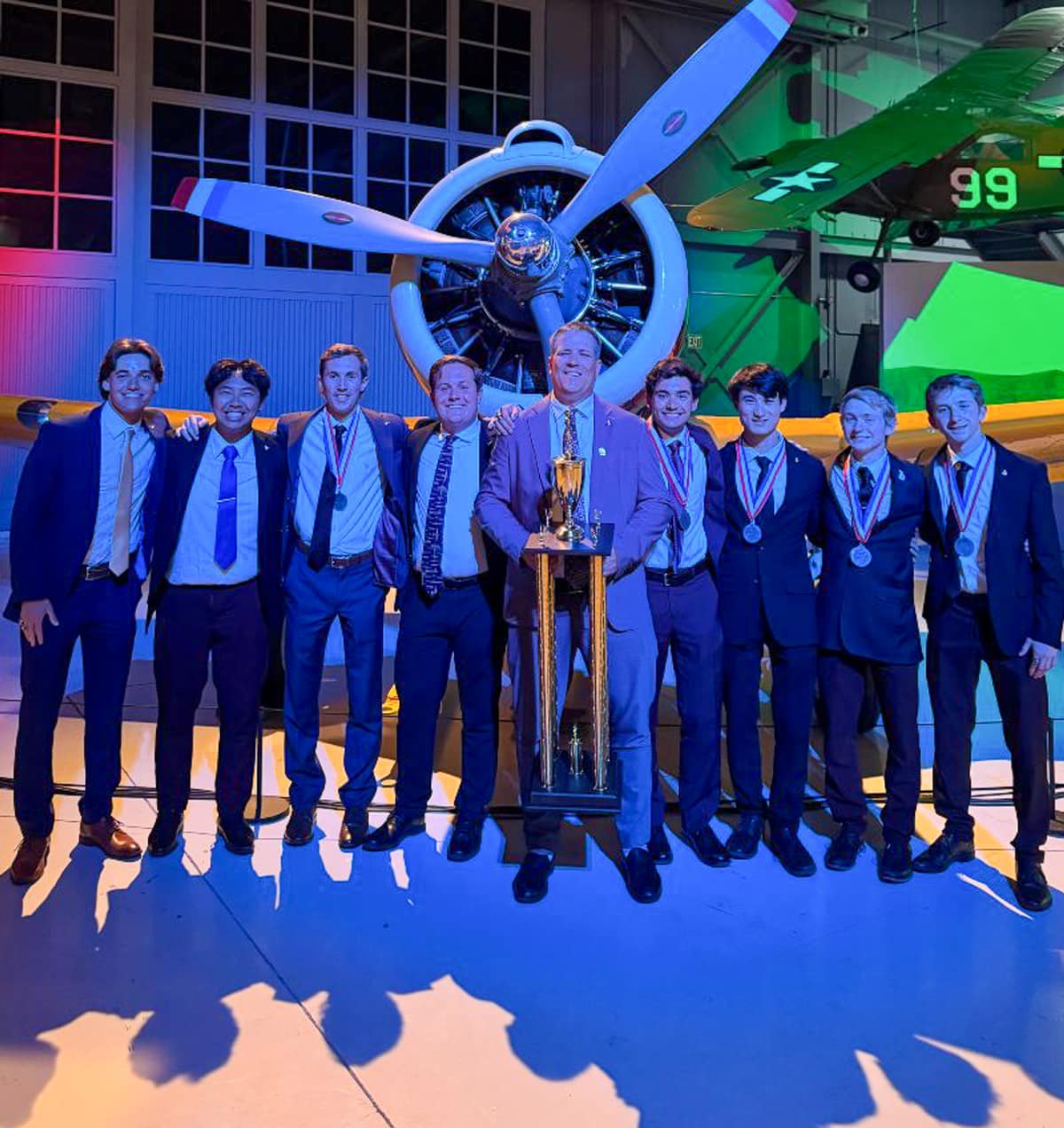 The 2025 Golden Eagles Flight Team’s graduating seniors and their coach.