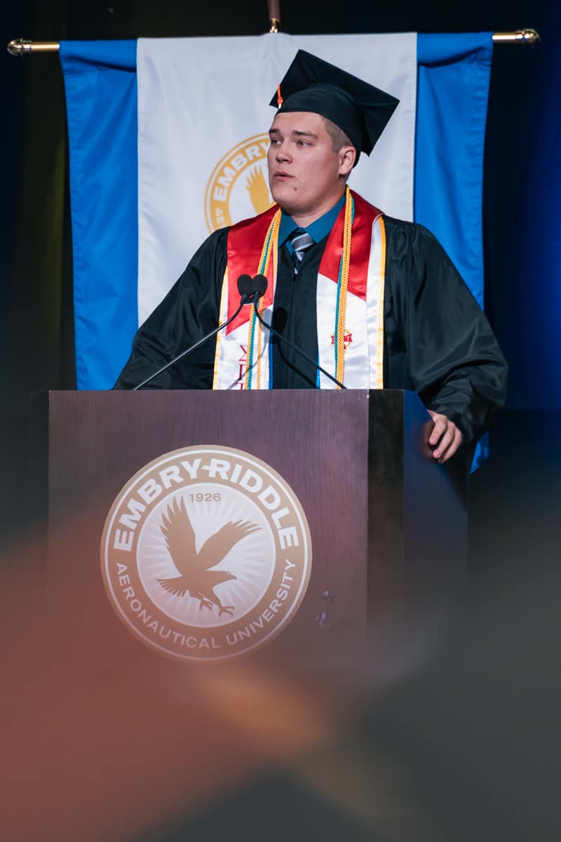 Man speaks at podium