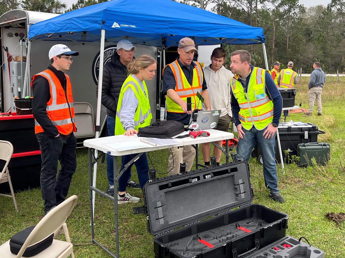 Staff and faculty work on a drone.