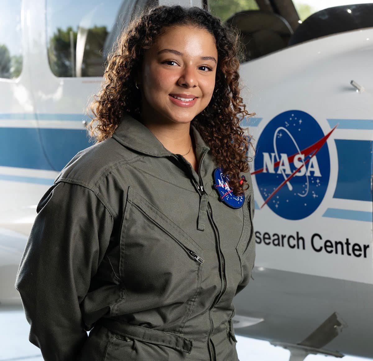 Ashley Tirado Pujols posing in a flight suit