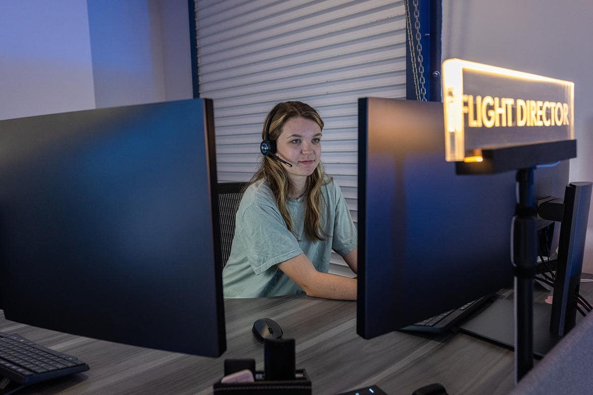 Student Kaelyn Tindall operates the launch simulator in the Satellite Mission Control Center.