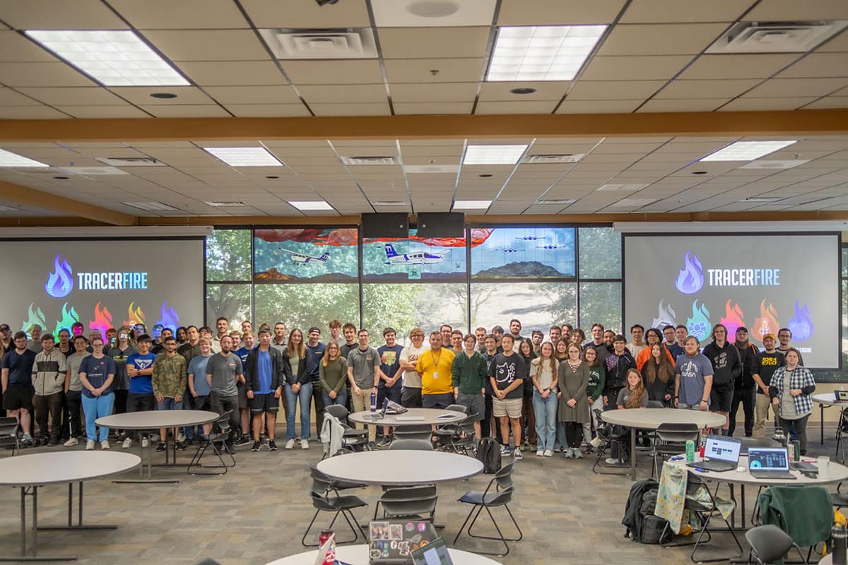 Participants from the Tracer FIRE 11 competition pose for a group photo