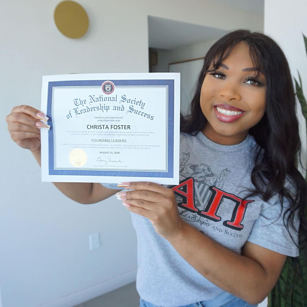 Aeronautics major Christa Foster proudly displays the Foundations of Leadership Certificate she earned from the National Society of Leadership and Success.