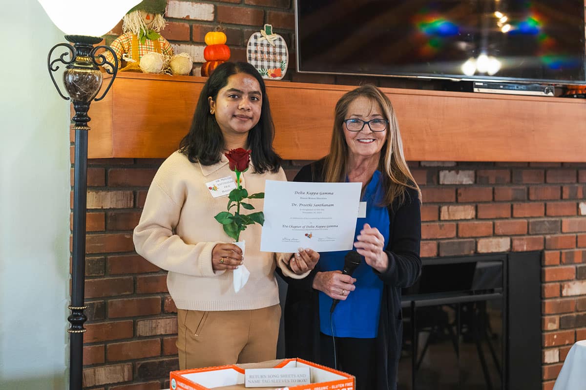 Dr. Preethi Santhanam (left), assistant professor of Cyber Intelligence and Security, and keynote speaker Susan Clark