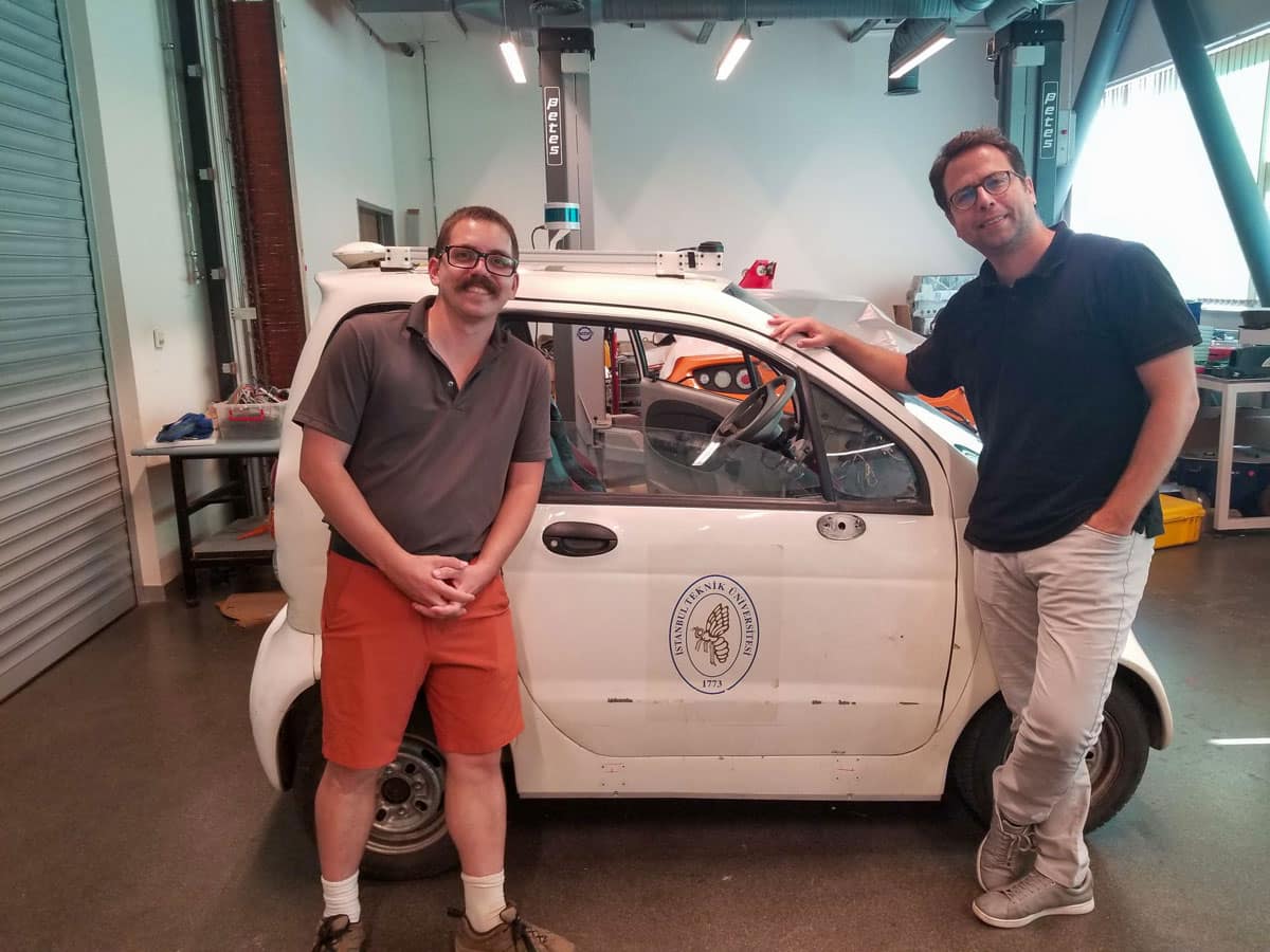 h.D. student Goss and Dr. M. Ilhan Akbas, associate professor in the university’s Department of Electrical Engineering & Computer Science, stand in Istanbul Technical University E-Mobility Lab.