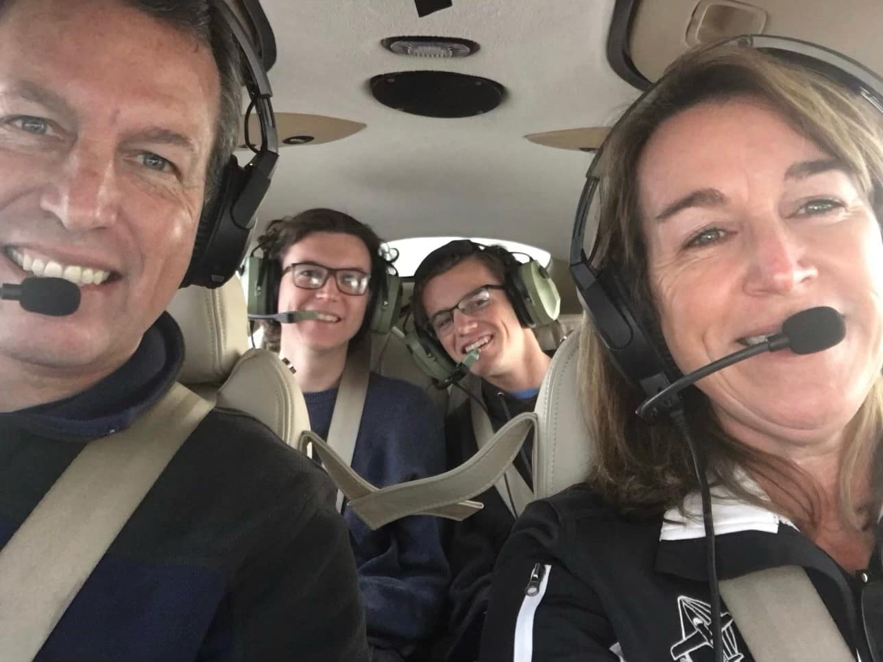 Man, woman and son in a plane