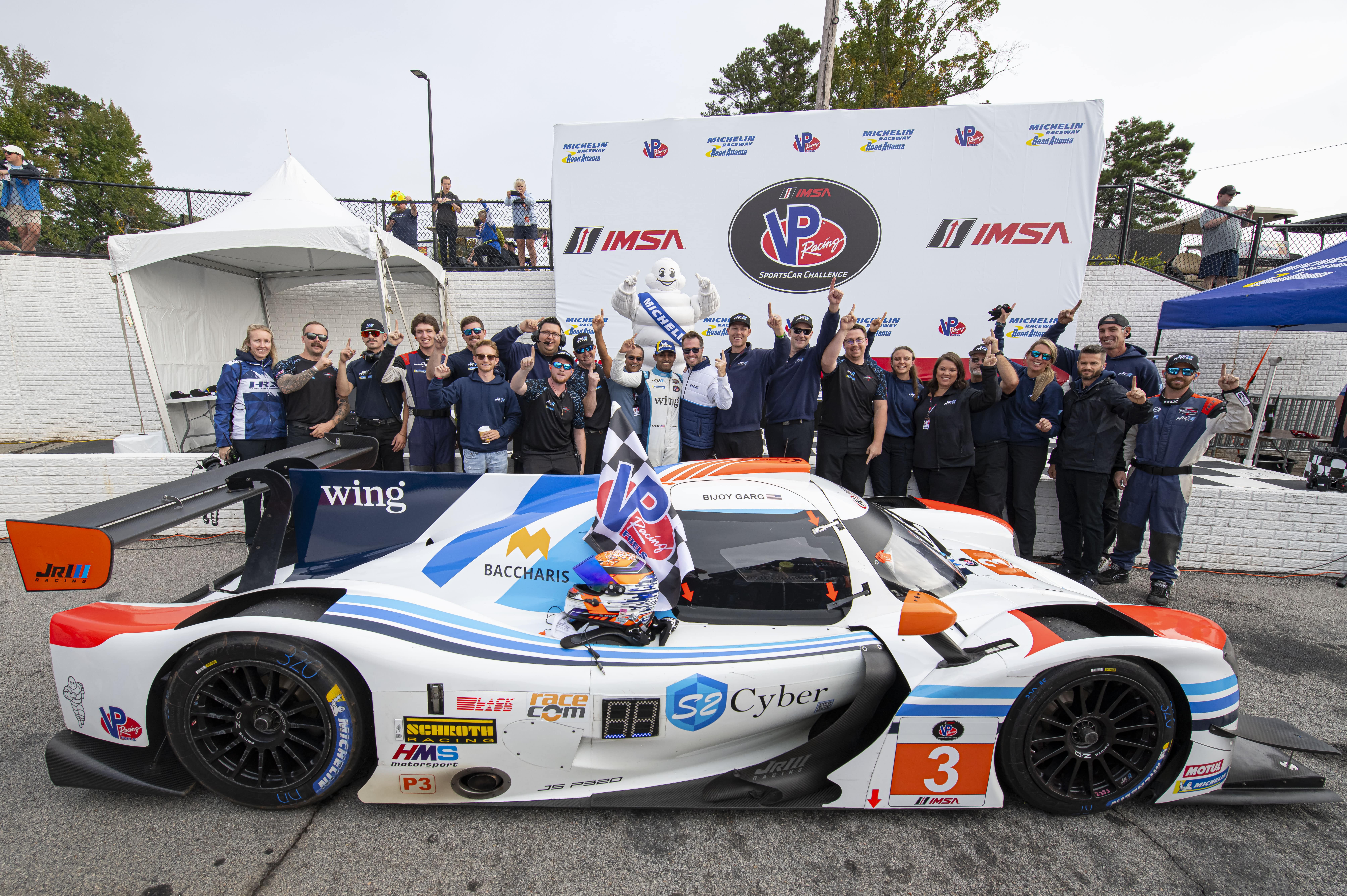 Racing team with their Indy Car.