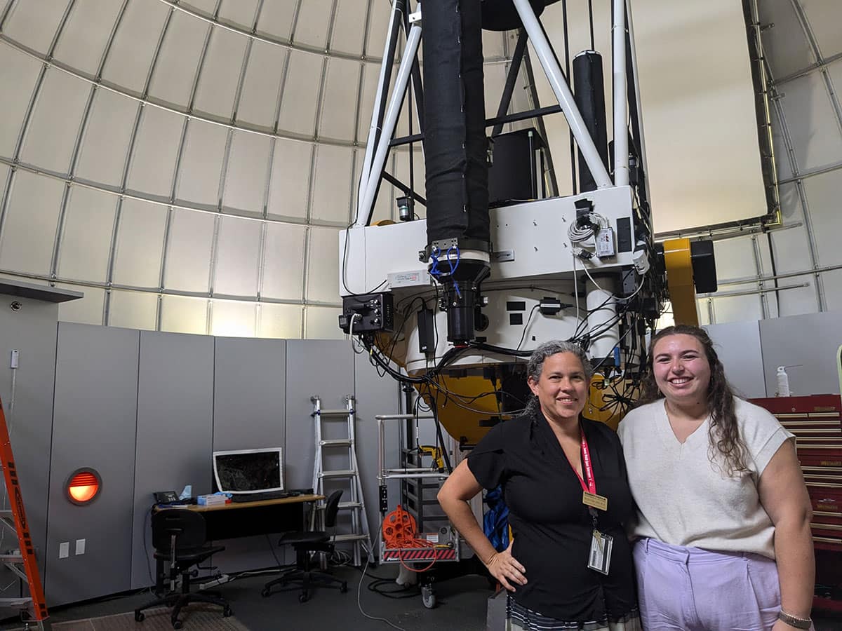 Professor Saida Caballero-Nieves (left) and NASA FINESST awardee Erin Abraham are pictured in front of Embry-Riddle's one-meter telescope on the Daytona Beach Campus