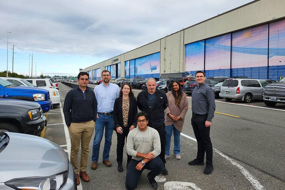 Embry-Riddle student Henil Patel joins members of the Airplane Safety Engineering (ASE) team in front of Boeing’s Everett, Washington, manufacturing factory