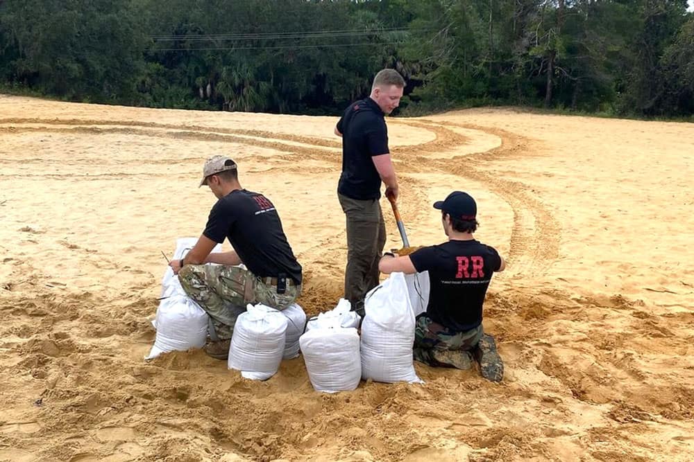 Embry-Riddle’s Red Rope team loads sandbags to help prepare residents for Hurricane Milton