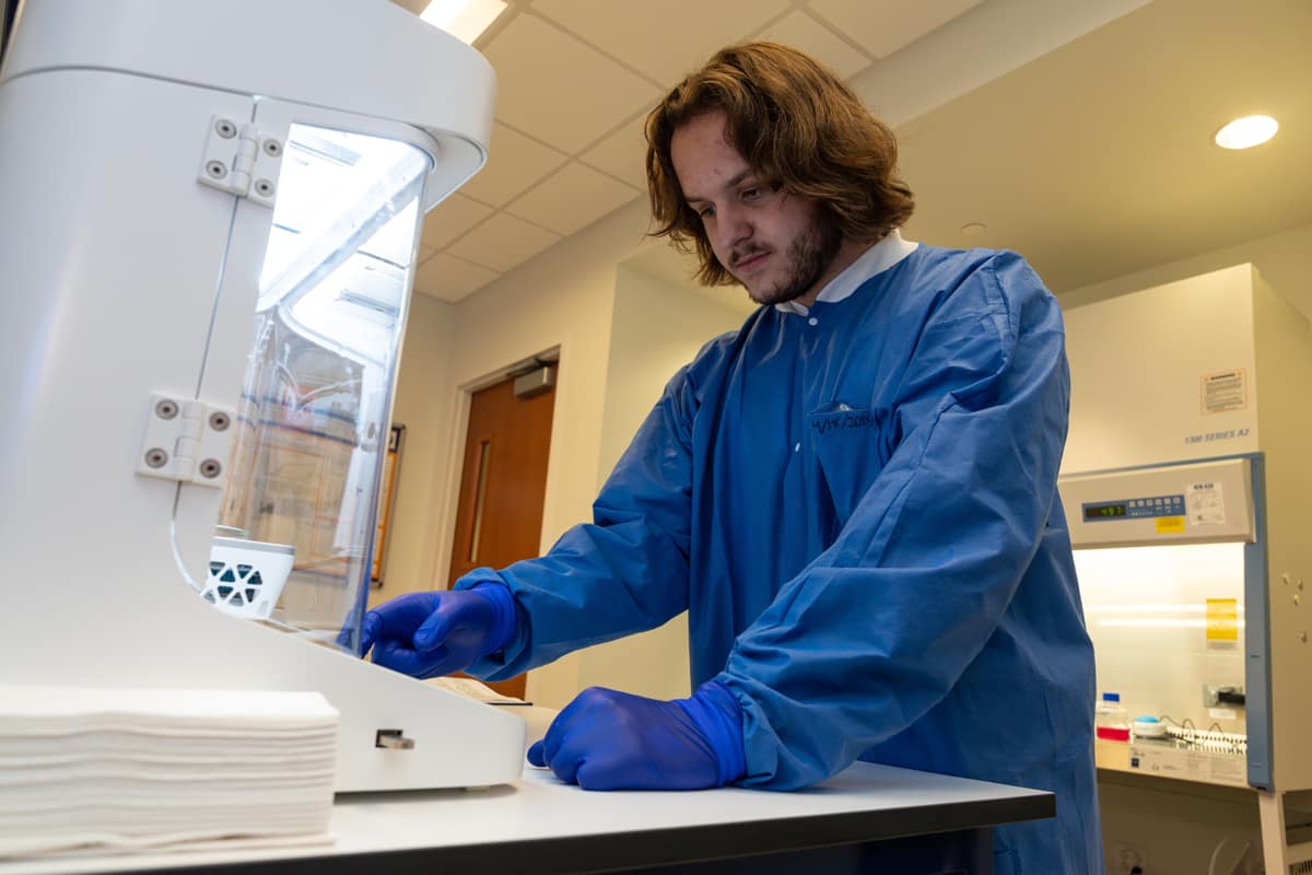 Kowalski, a sophomore in the biomedical engineering track of a Mechanical Engineering major, programs the bioprinter.