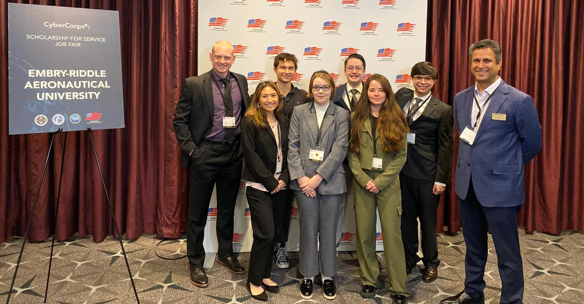 Dr. Krishna Sampigethaya attended the CyberCorps event with students from Embry-Riddle's Prescott Campus, pictured from left to right, Cameron Devaney, Isabella Cromwell, Kestrel Carlough, Victoria Plinski, Sam De Kemper, Jesse Hix and Justin La Zare.