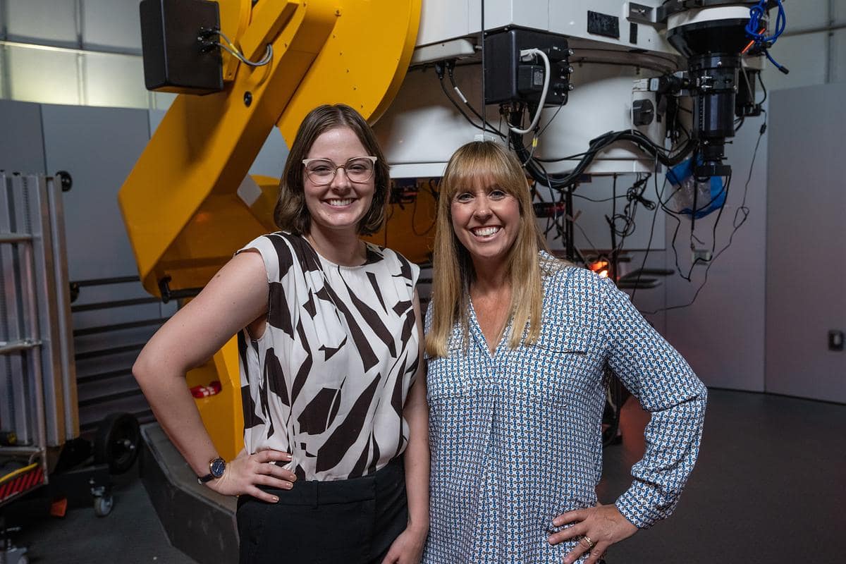 Graduate teaching assistant Kayla Taylor and her mentor, Dr. Ashley Lear, pose in the College of Arts and Sciences Observatory.