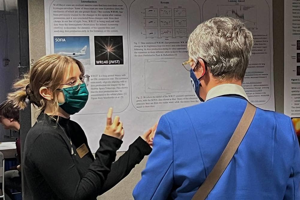 Megan Peatt explained her Embry-Riddle research on Wolf-Rayet star systems to famed astrophysicist Dr. Jocelyn Bell Burnell at PhysCon 2022