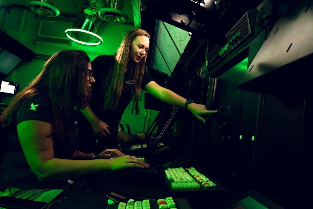 Magdalena Kokenge works with Air Traffic Control lab manager Carol Martin.