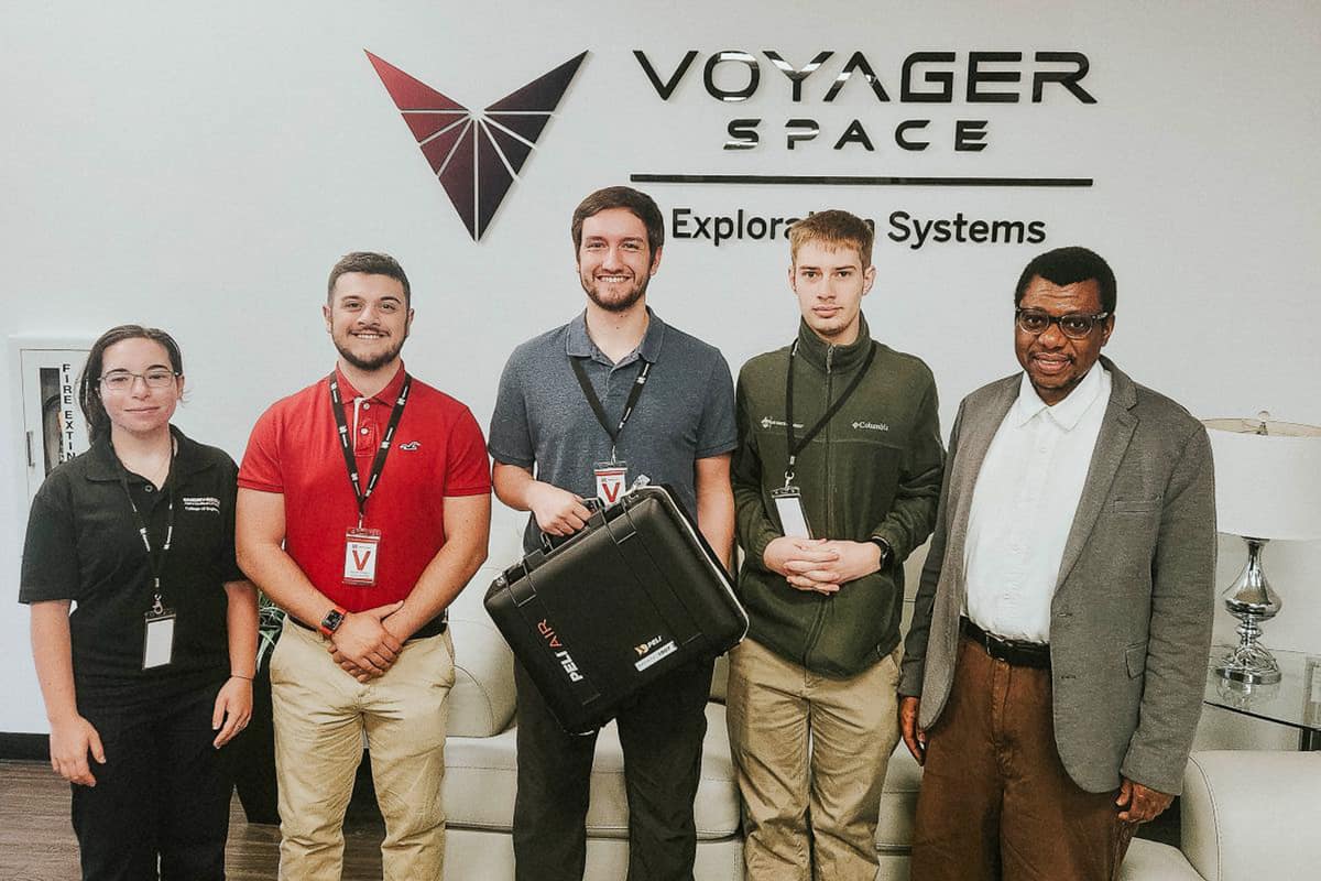 The EagleSat-2 team, which includes students Ela Ozatay, Jimi Wadnola, Bruce Noble, Gary Wiens and faculty mentor Dr. Ahmed Iyanda Sulyman, visits Voyager Technologies in Webster, Texas.