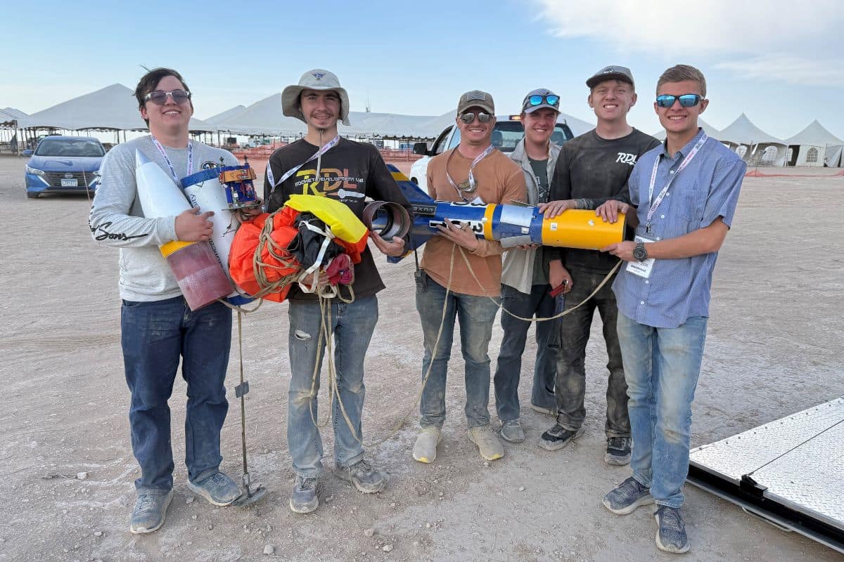 Team members from Embry-Riddle’s Rocket Development Lab at the International Rocket Engineering Competition (IREC) in Midland, Texas. Holding the team’s rocket (from left to right) are: alumnus Bryce Chanes (’18); students Quentin Trull, Shea Schmidt, Chase Ahrens, Kevin Wise, Ben Lambertson, Calvin Lindemann; and Professor Mark Benton, the team’s faculty advisor.