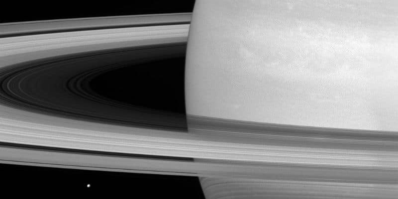 A recent photo taken by the Cassini spacecraft shows the enormity of Saturn’s rings as compared to its icy moon, Mimas.