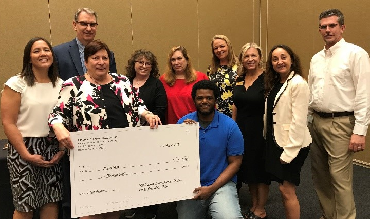 Pictured: (Back) Dr. John Griffith, (L to R) Molly Justice, Denise Lind, Dr. Donna Roberts, Dr. Debra Bourdeau, Casey Brown, Kristina Morton, Dr. Leila Halawi, Mitch Aten, (kneeling) ERAU student representing Project Haiti. (Photo: Leadership Institute)