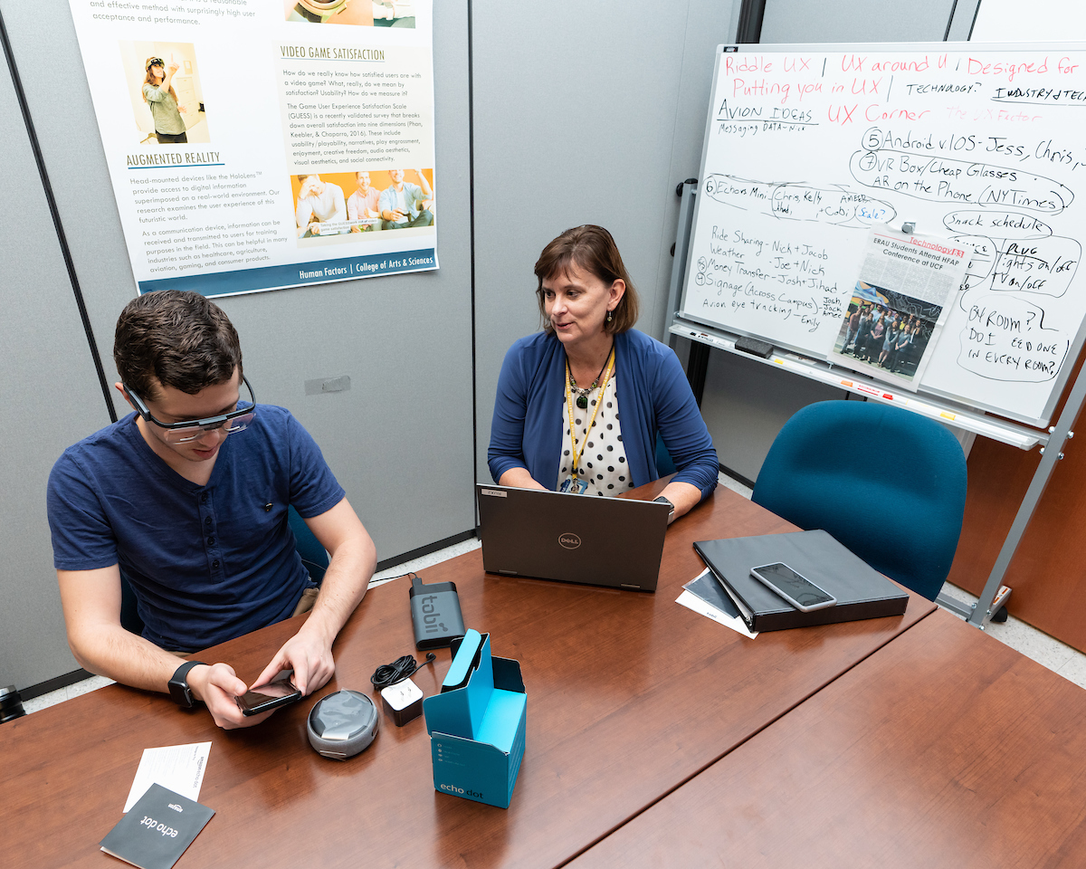 Graduate student Jacob Benedict, with Dr. Barbara Chaparro, uses Tobii Pro eye-tracking glasses as part of user experience research.