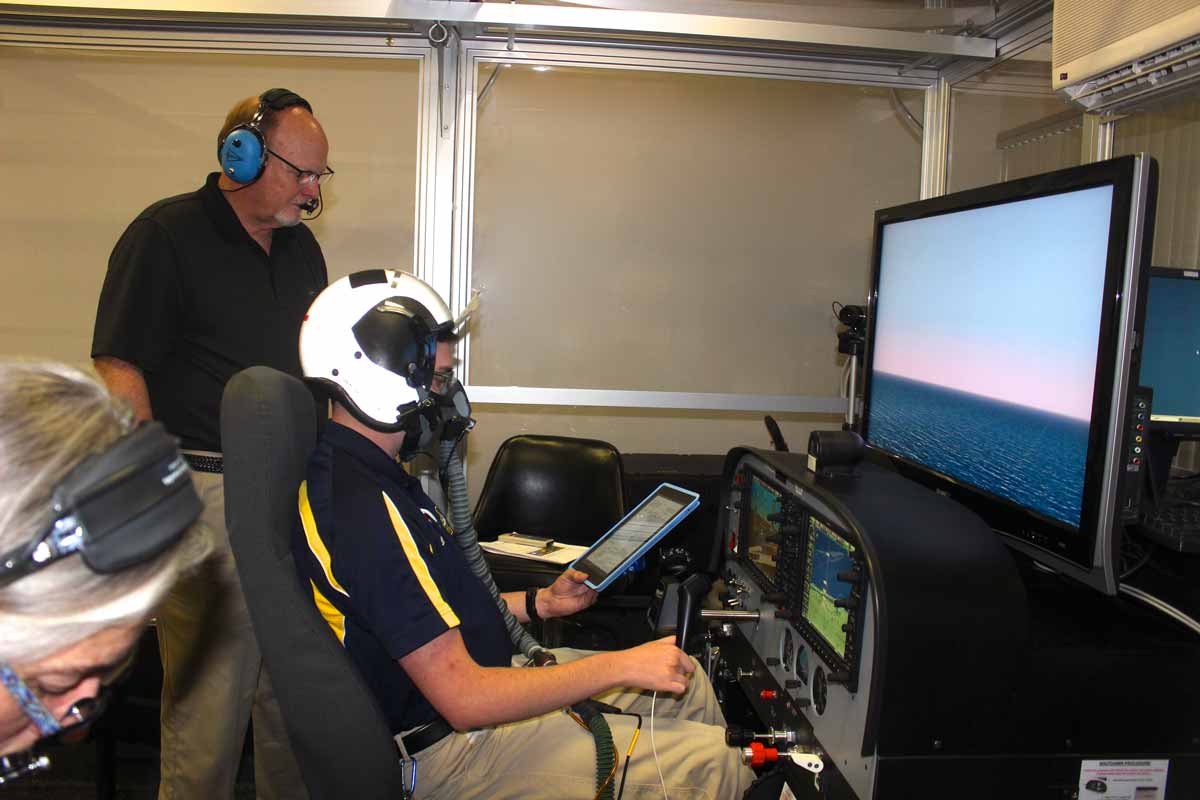 Inside Embry-Riddle’s High-Altitude Laboratory, Joshua Swain took part in pilot hypoxia training, answering questions about his symptoms as he flew a simulated instrument approach, monitored by faculty member Michael Coman. Swain graduated in 2017 and now works as a Geospatial Analyst, specializing in Aeronautical Safety of Navigation for the U.S. Department of Defense.