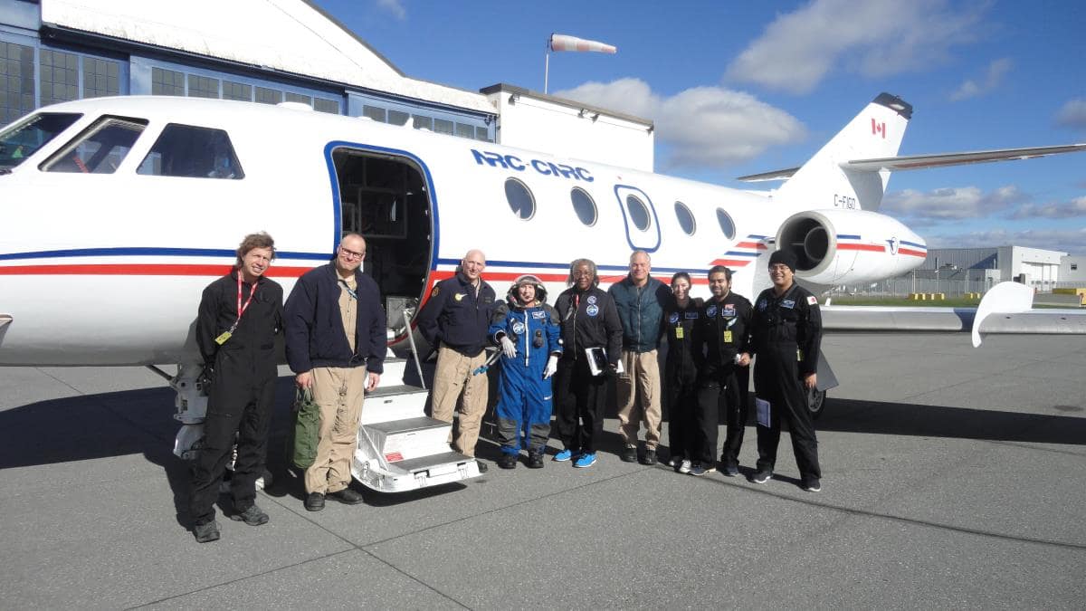 Hammerstein and Brun (center) with NRC and PoSSUM microgravity team. Photo courtesy of Karen Brun.