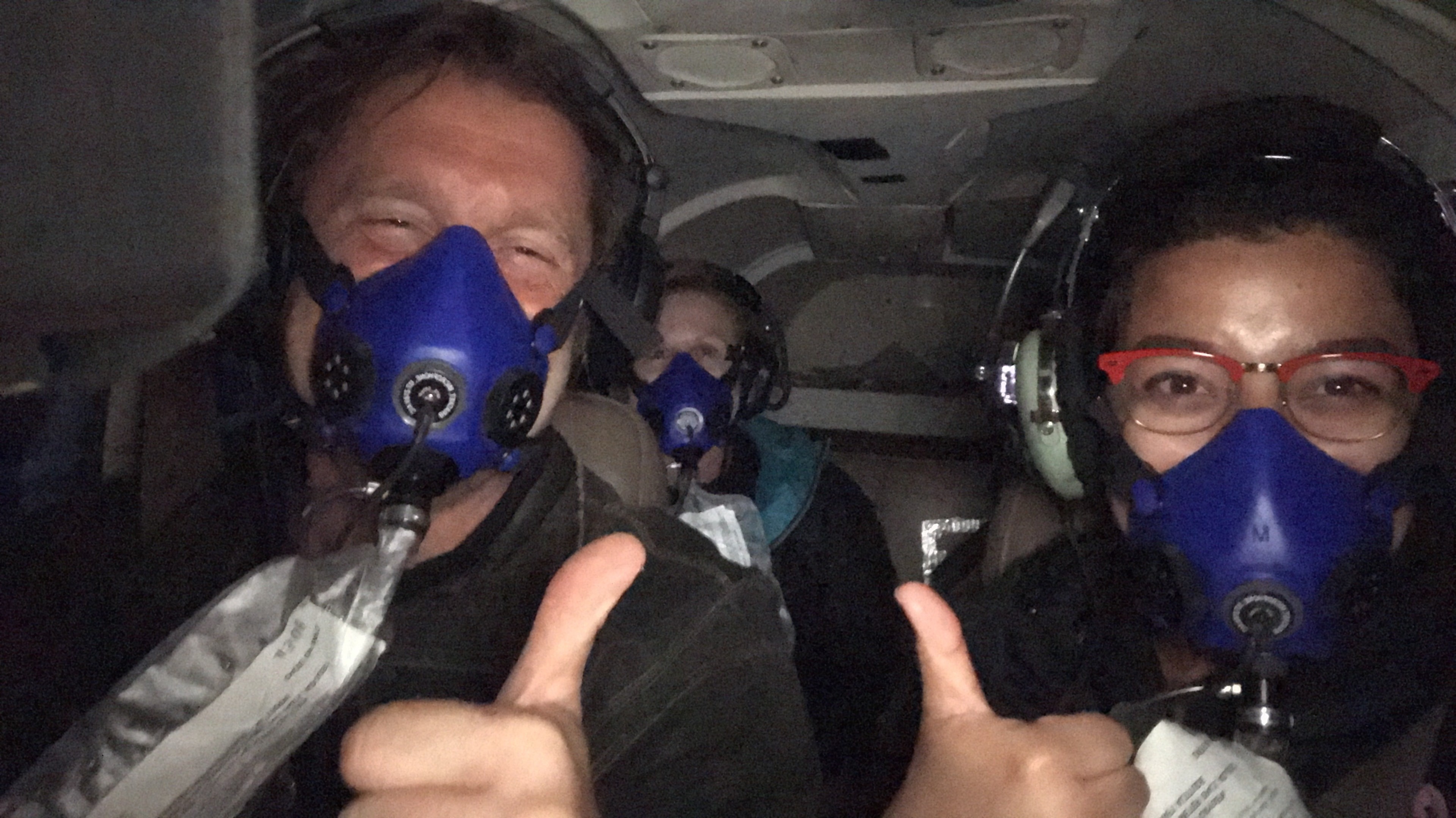 Embry-Riddle students Amy Ramos (front, right) and Heidi Hammerstein (back), with Dr. Jason Reimuller, director of Project PoSSUM in a modified Mooney Research Jet during a mission to study icy “space clouds” in High Level, Alberta, Canada.