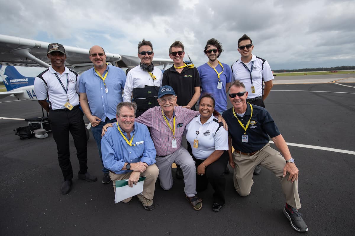 Professionals gather for a photo at Embry-Riddle Aeronautical University's Daytona Beach Campus.  