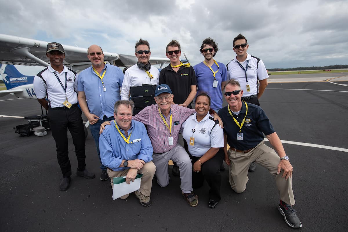 Professionals gather for a photo at Embry-Riddle Aeronautical University's Daytona Beach Campus.