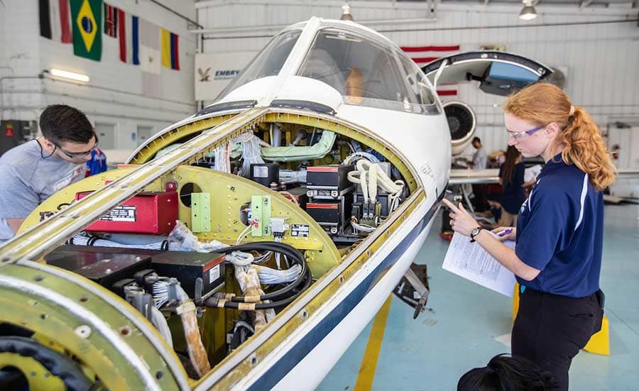 Aviation Maintenance Science students work on a Lear jet.