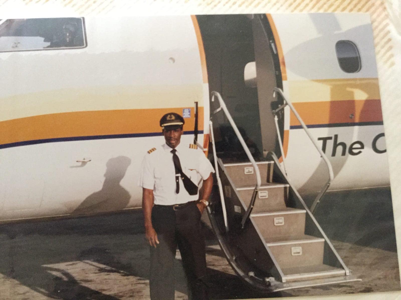 pilot Garfield McFarlane in front of an aircraft